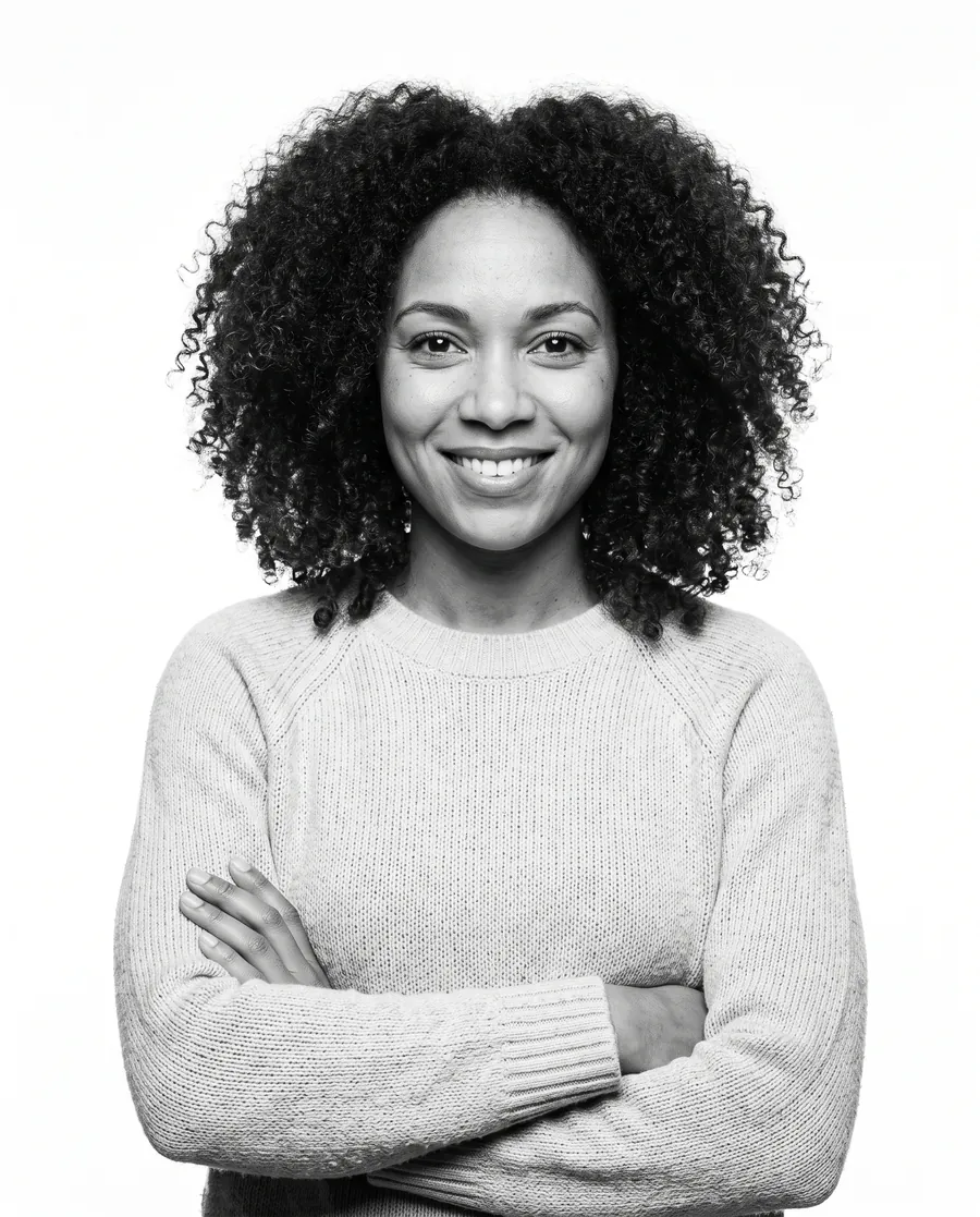 Smiling Research and Metric researcher with arms crossed